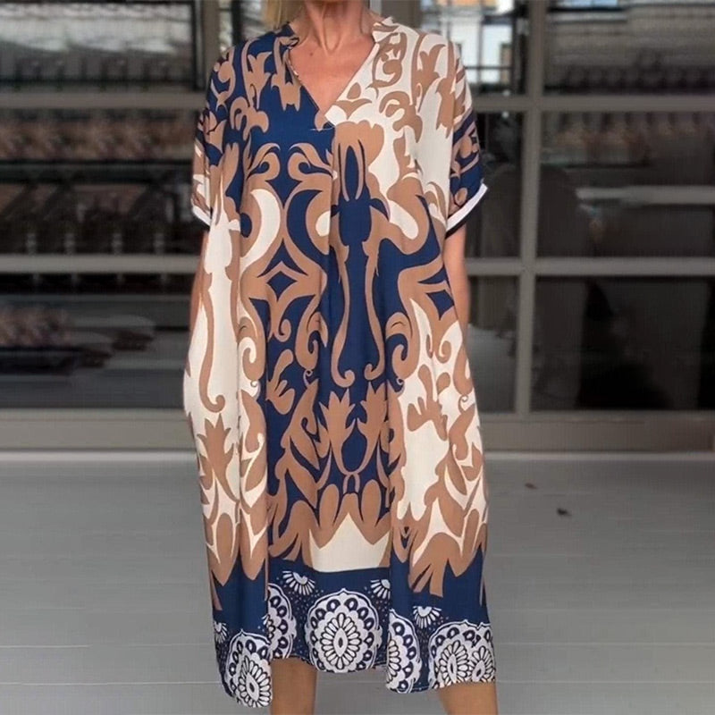 MW | Eng geschnittenes Midi-Kleid mit elegantem Druckmuster