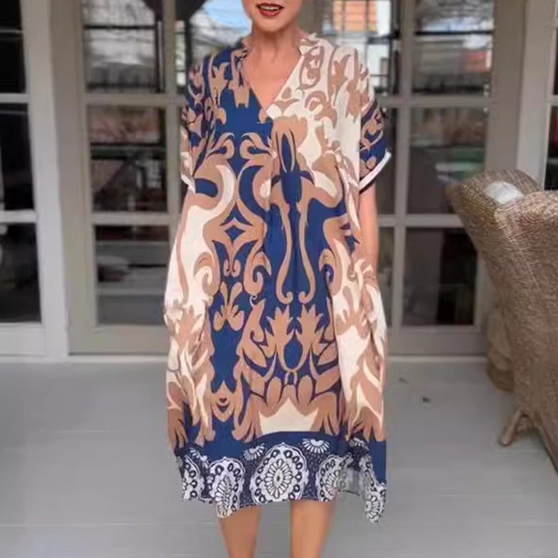 MW | Eng geschnittenes Midi-Kleid mit elegantem Druckmuster