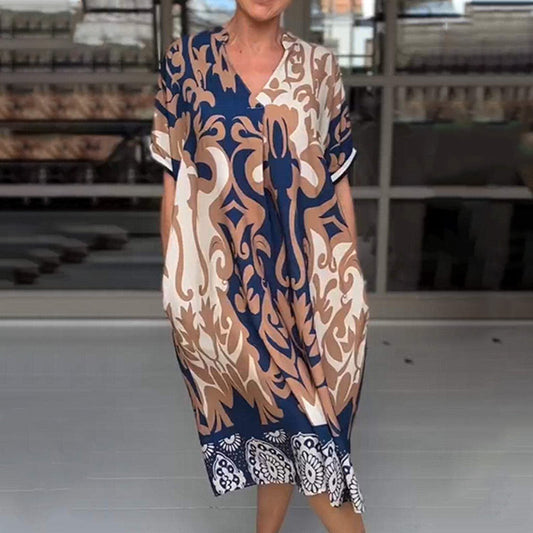 MW | Eng geschnittenes Midi-Kleid mit elegantem Druckmuster