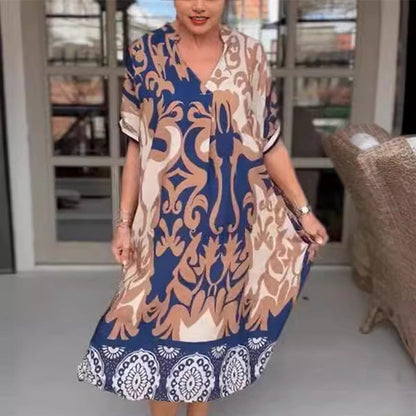 MW | Eng geschnittenes Midi-Kleid mit elegantem Druckmuster